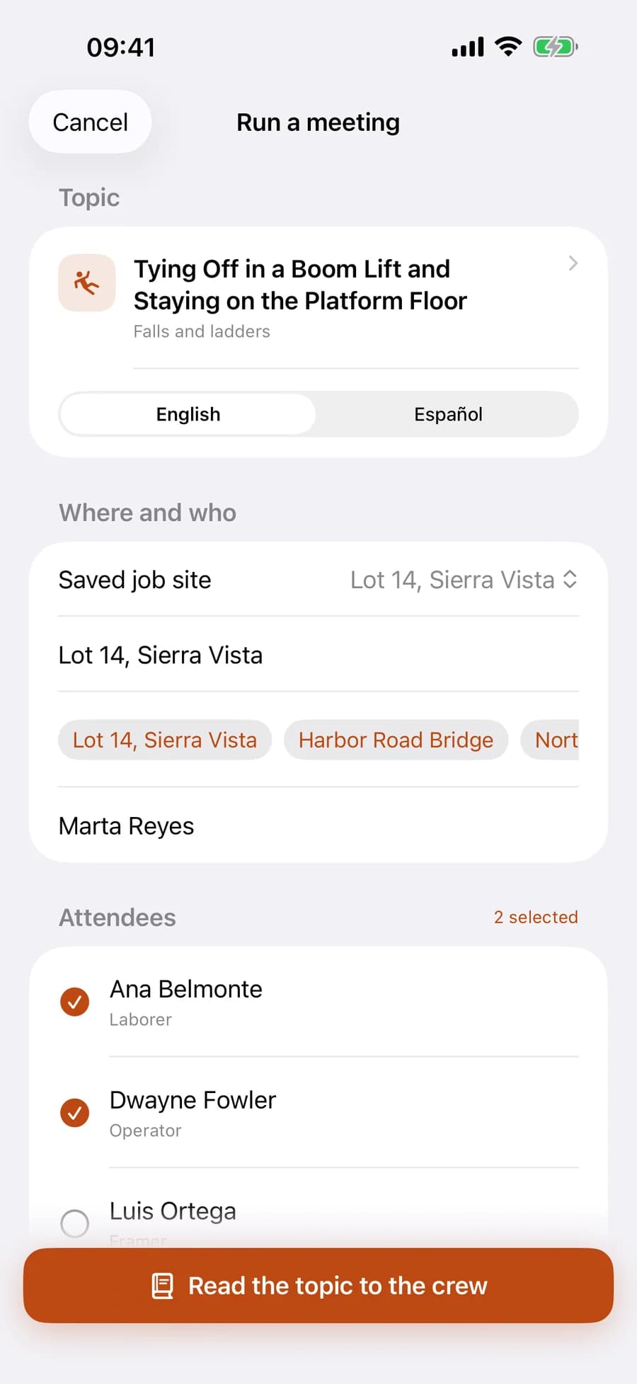 The Run a meeting screen: a chosen talk on falls and ladders, an English and Español switch, a saved job site, and a crew list with two attendees already checked.